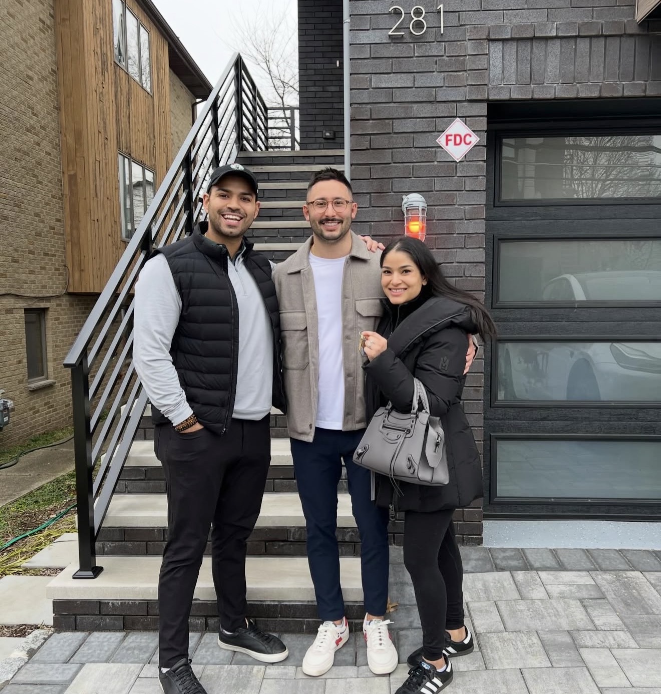 Anthony Iemmello celebrating a home purchase with clients